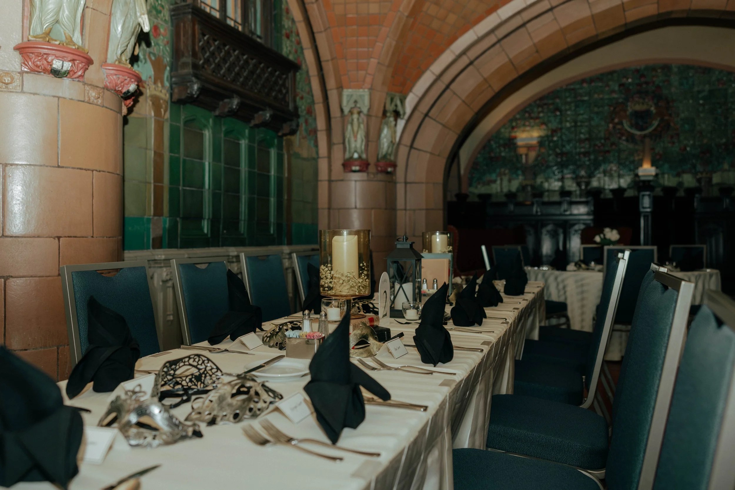 A candlelit reception setup inside The Rathskeller, The Seelbach Hotel’s famous underground ballroom lined with emerald Rookwood tiles and echoes of the Roaring Twenties.